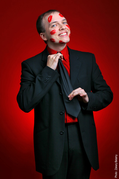 Portrait « Kiss Me » of French magician Boris Wild on a red background