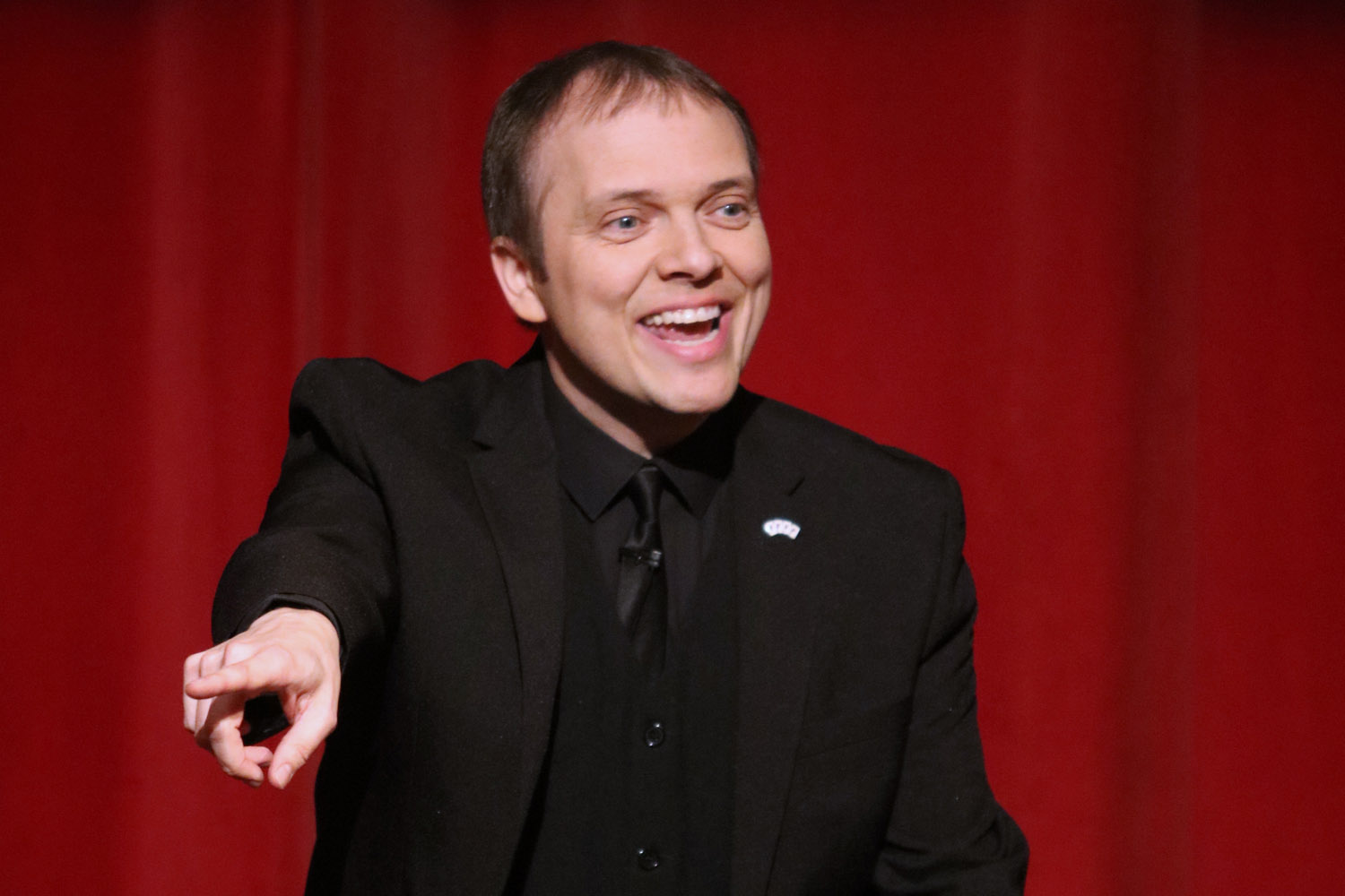 The French magician Boris Wild on stage emceeing a show