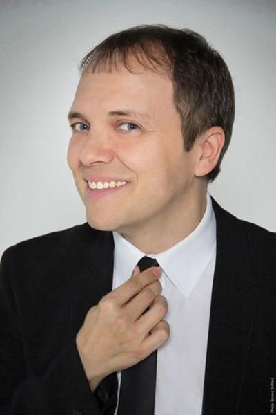 Portrait of French magician Boris Wild with a tie and tuxedo