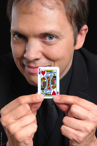 Portrait of French magician Boris Wild with a King of Hearts